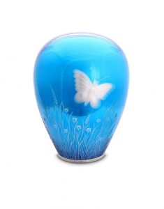 Urne en cristal avec papillon bleu